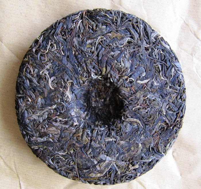 Galette de dos - Puer Sheng BanPoZhai 250g [photo Cream of Banna]