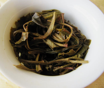 Feuilles infusées - Puer Sheng BanPoZhai 250g [photo Cream of Banna]