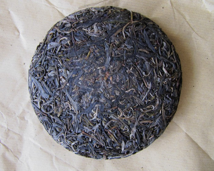 Galette de face - Puer Sheng ManZhuan 250g [photo: Cream of Banna]