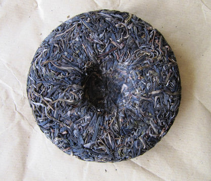 Galette de dos - Puer Sheng ManZhuan 250g [photo: Cream of Banna]